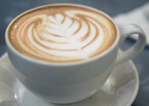 white cup with latte